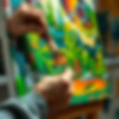 An artist using a brush to apply oil paint on canvas