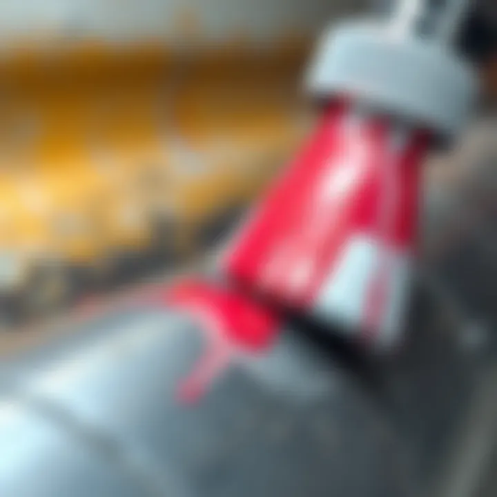 Close-up of a chemical paint remover applied on metal